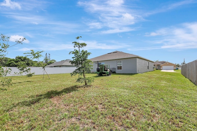 view of yard featuring a garage