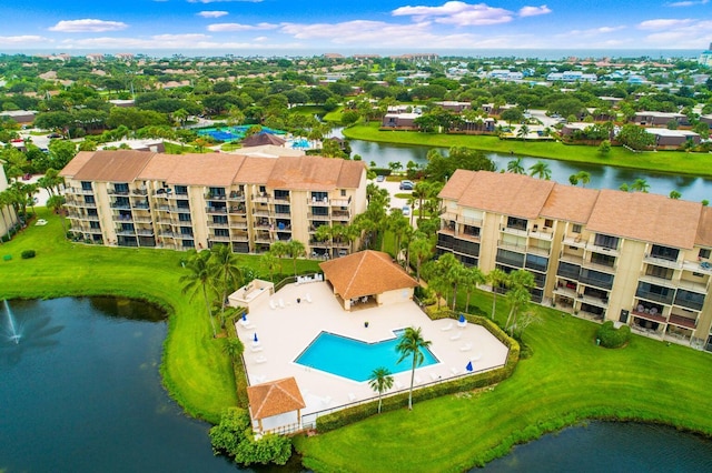 birds eye view of property with a water view