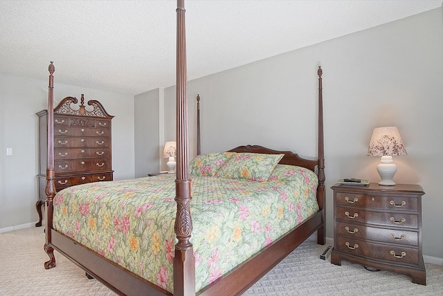 carpeted bedroom with a textured ceiling