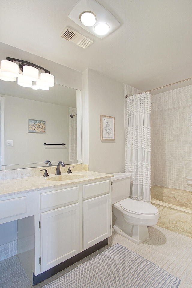 bathroom with vanity, a shower with curtain, toilet, and tile patterned floors