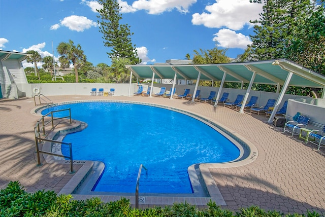 view of swimming pool with a patio