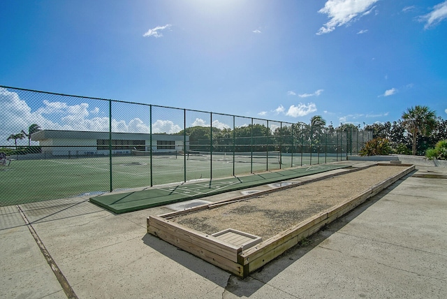 surrounding community featuring tennis court