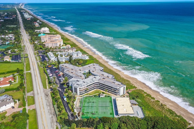 drone / aerial view with a view of the beach and a water view