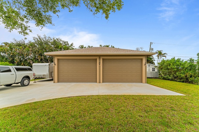 garage with a lawn