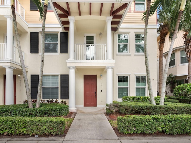 view of front of home with a balcony