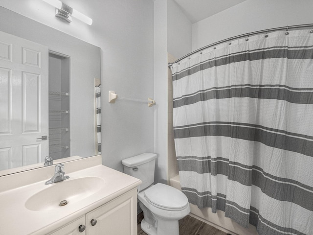 full bathroom with vanity, toilet, shower / bath combination with curtain, and hardwood / wood-style floors