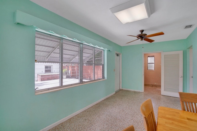 interior space featuring a healthy amount of sunlight and ceiling fan