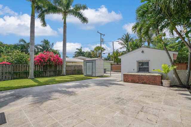 view of patio / terrace with a storage shed