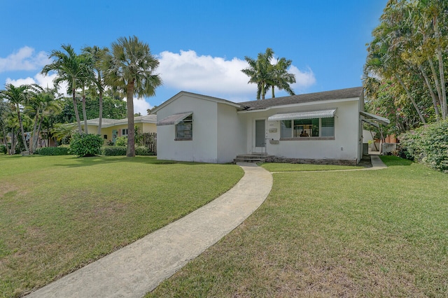 ranch-style home with a front lawn