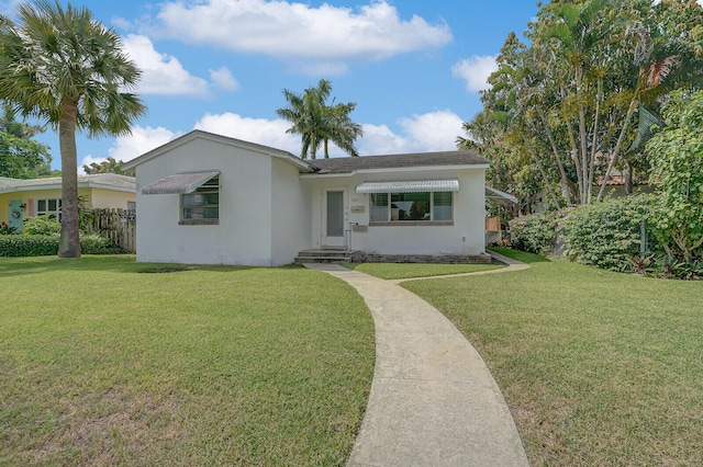 single story home with a front yard