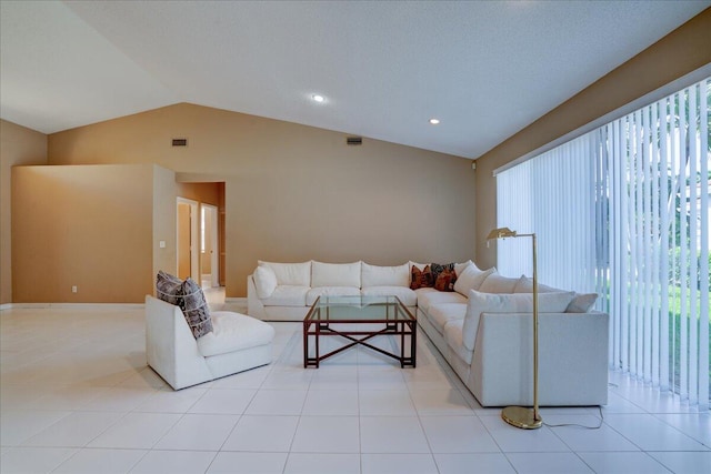 living room featuring light tile patterned floors and vaulted ceiling