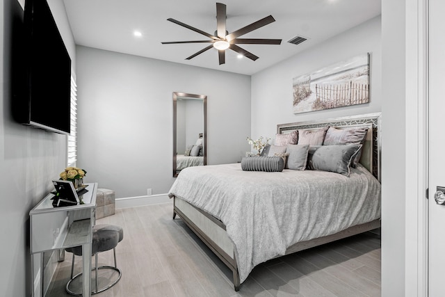 bedroom featuring ceiling fan and light hardwood / wood-style flooring