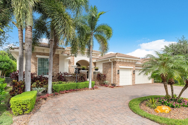 mediterranean / spanish-style house featuring a garage