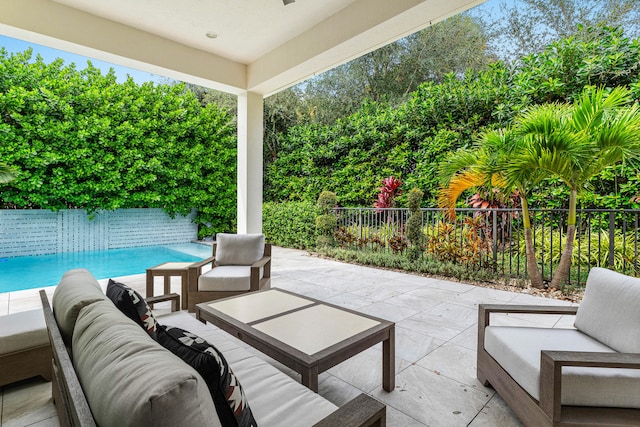 view of patio featuring an outdoor hangout area and a fenced in pool