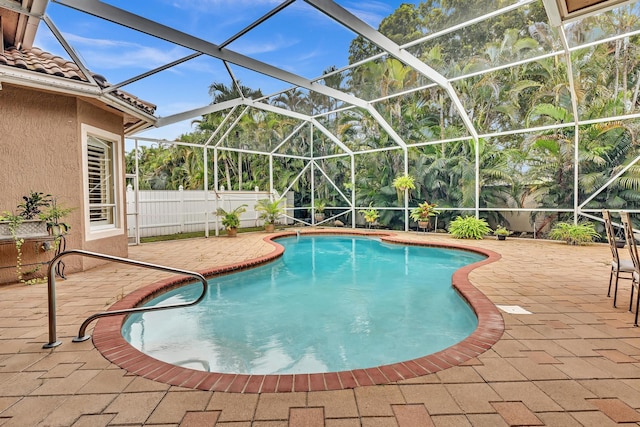 view of pool featuring a patio and a lanai