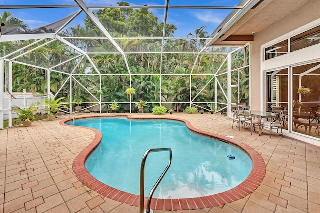 view of pool featuring a patio area and a lanai