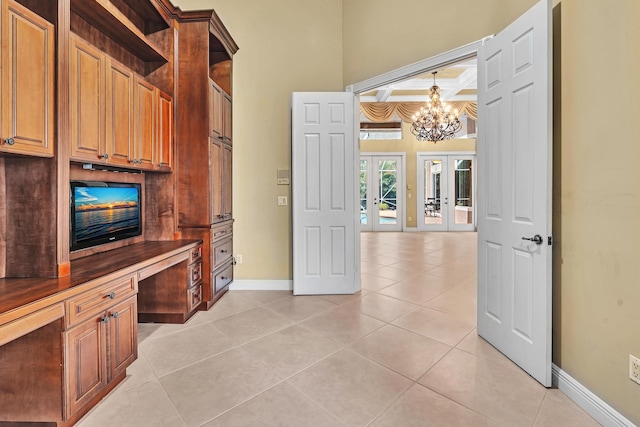 interior space with beamed ceiling, french doors, a notable chandelier, and light tile patterned floors