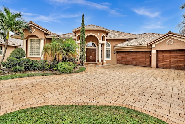 mediterranean / spanish-style home featuring a garage