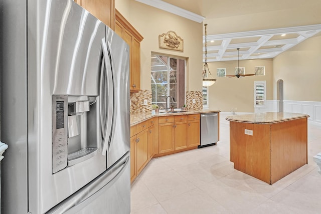 kitchen with appliances with stainless steel finishes, sink, hanging light fixtures, coffered ceiling, and decorative backsplash