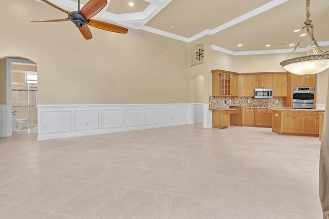 kitchen with tasteful backsplash, hanging light fixtures, ceiling fan, light tile patterned floors, and crown molding