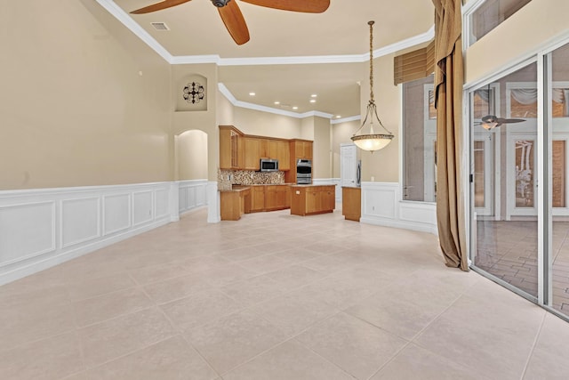 unfurnished living room featuring crown molding, ceiling fan, and light tile patterned floors