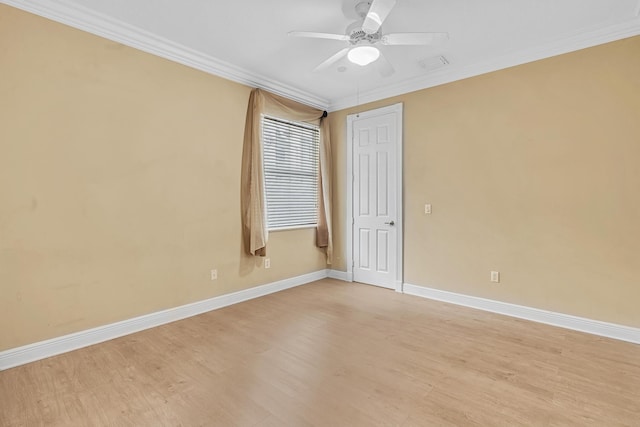 empty room featuring crown molding, light hardwood / wood-style flooring, and ceiling fan