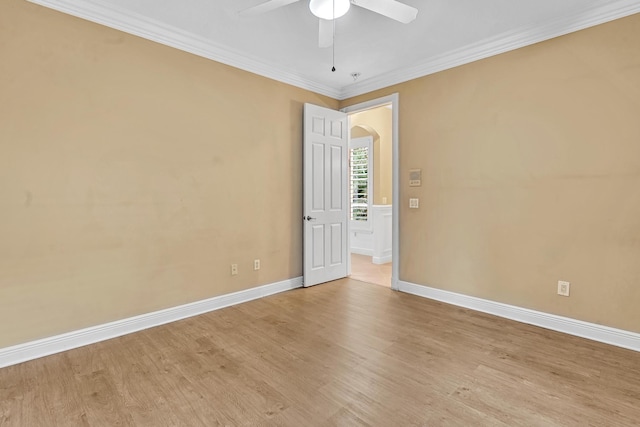 unfurnished room featuring ornamental molding, light hardwood / wood-style floors, and ceiling fan