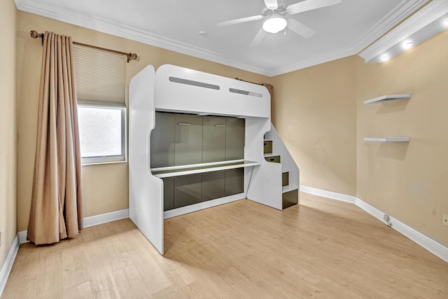 unfurnished living room with ornamental molding, light hardwood / wood-style flooring, and ceiling fan