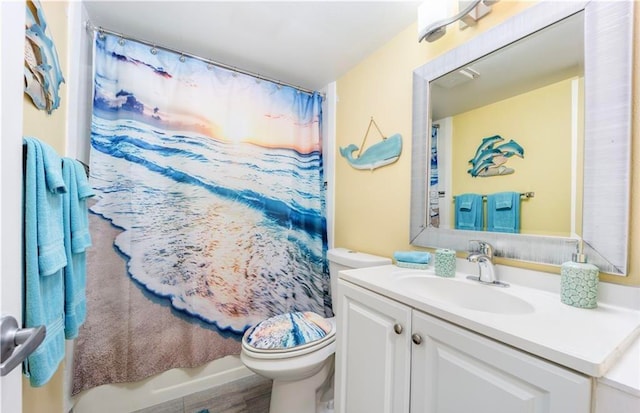 full bathroom featuring vanity, toilet, shower / bath combo, and hardwood / wood-style floors