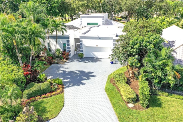 view of front of home with decorative driveway