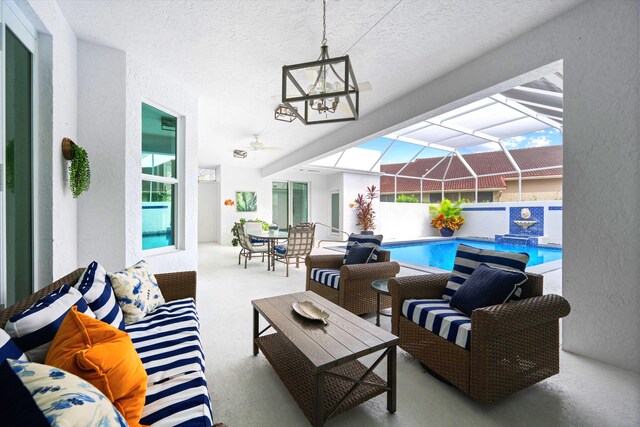 view of patio / terrace featuring glass enclosure, an outdoor hangout area, and a fenced in pool