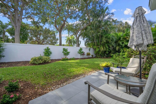 view of patio / terrace featuring fence