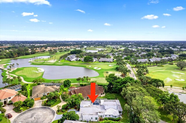 bird's eye view with golf course view, a water view, and a residential view