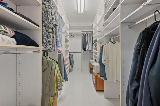 spacious closet featuring tile patterned floors