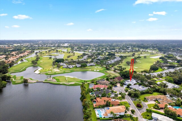 aerial view with a water view, a residential view, and golf course view