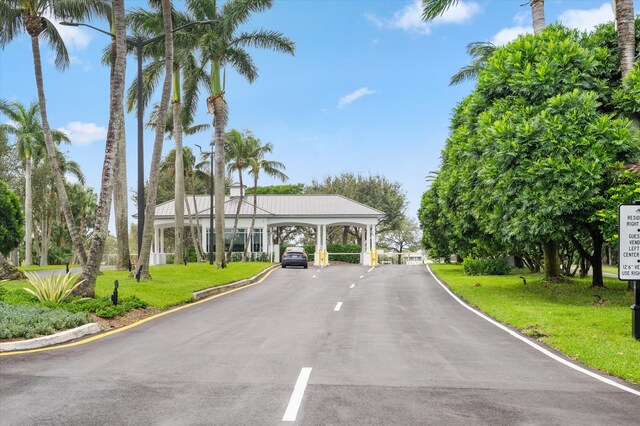 view of road featuring a gated entry