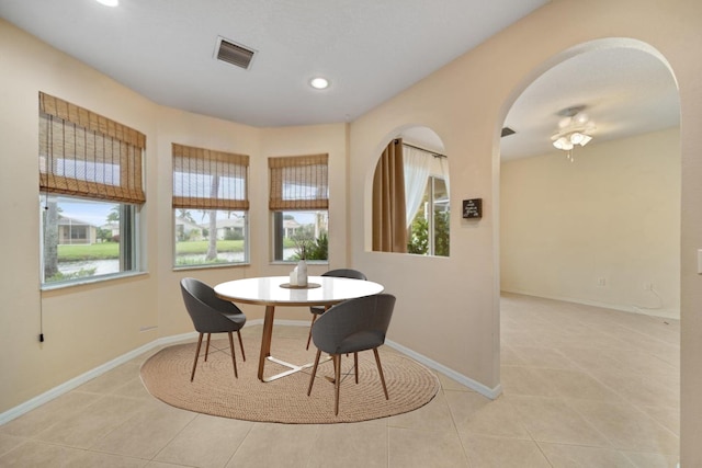 dining room featuring light tile patterned floors, baseboards, visible vents, and recessed lighting