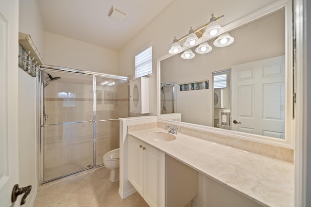 full bathroom with a stall shower, visible vents, vanity, and tile patterned floors