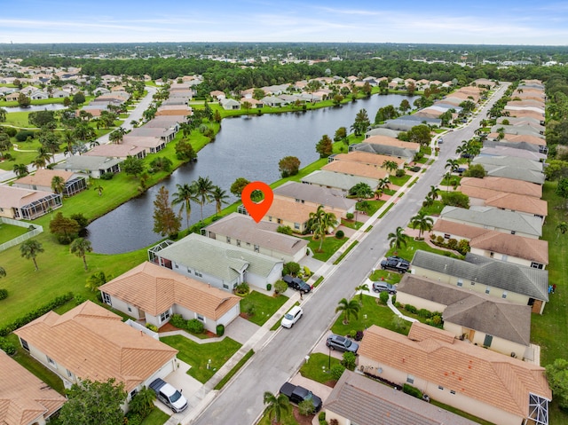 bird's eye view featuring a water view and a residential view