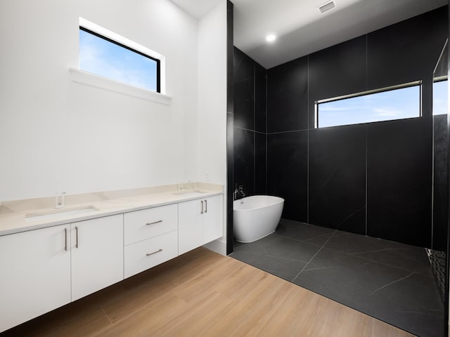 bathroom featuring vanity, a bidet, and hardwood / wood-style floors