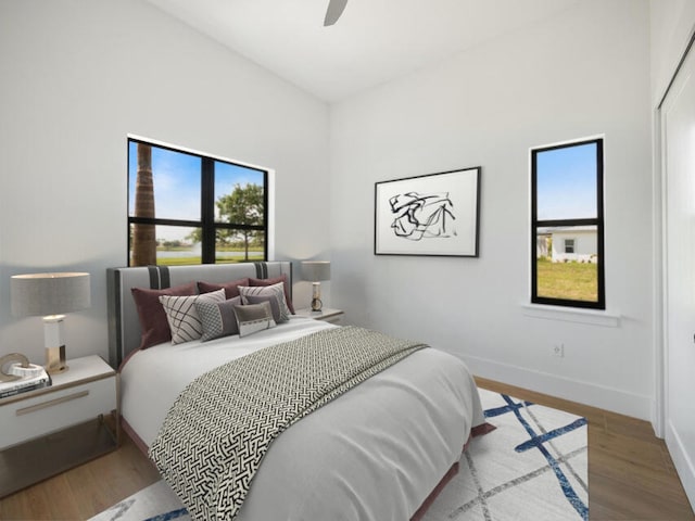 bedroom featuring hardwood / wood-style floors and ceiling fan