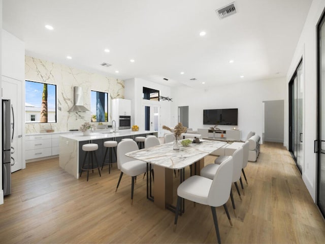 dining area with light wood-type flooring