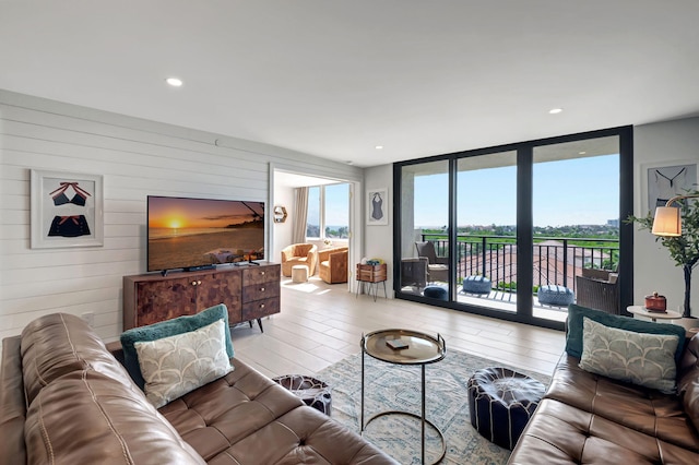 living room with light hardwood / wood-style flooring