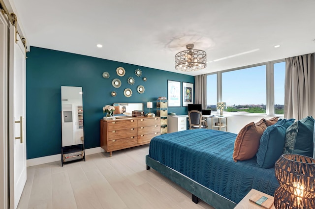 bedroom with light hardwood / wood-style floors