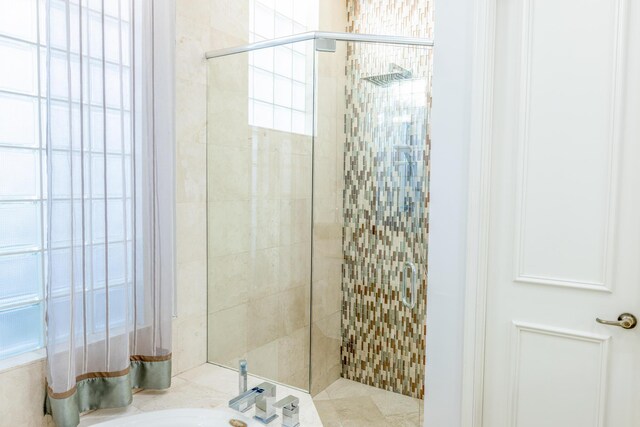 bathroom with vanity and separate shower and tub