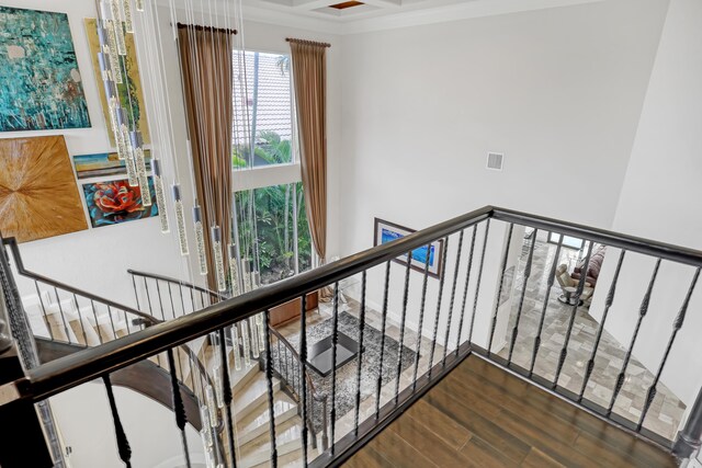 interior space featuring beam ceiling, coffered ceiling, and dark hardwood / wood-style flooring