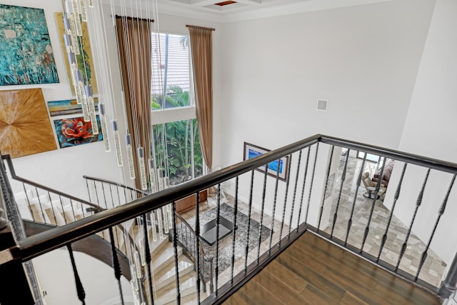 stairway featuring wood-type flooring and coffered ceiling