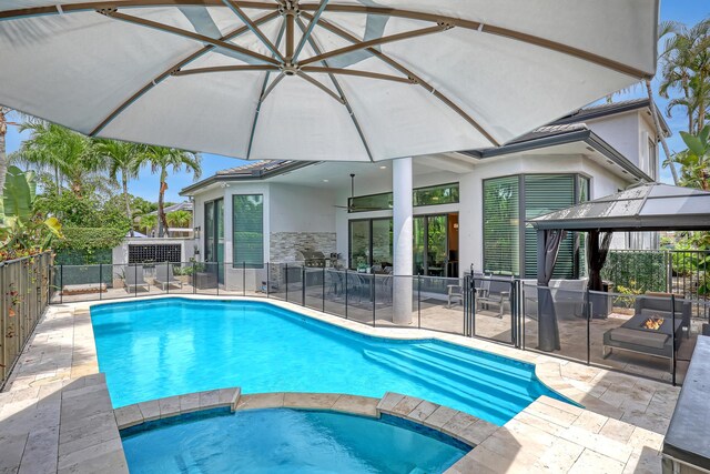 view of swimming pool with a gazebo and a patio