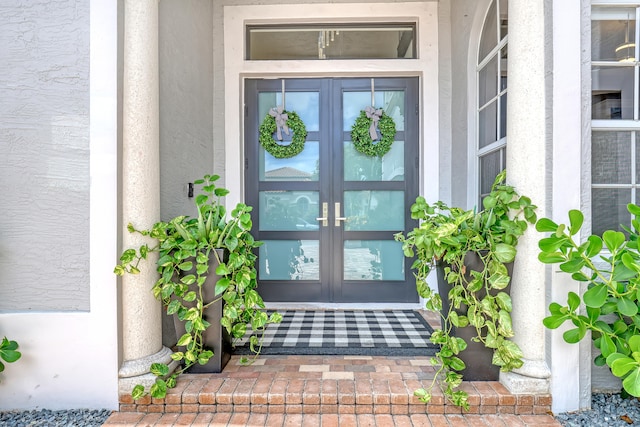 view of exterior entry featuring french doors