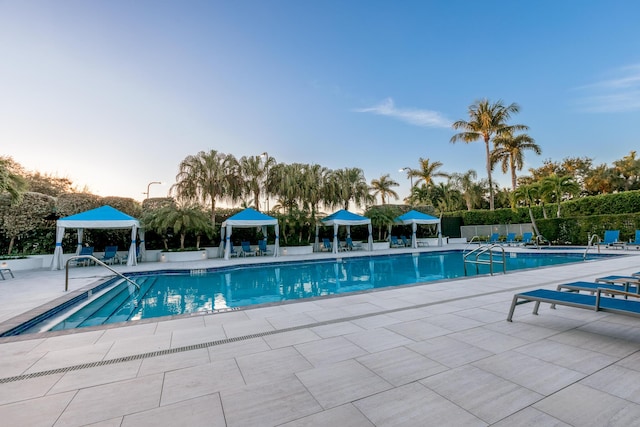 view of swimming pool featuring a gazebo and a patio